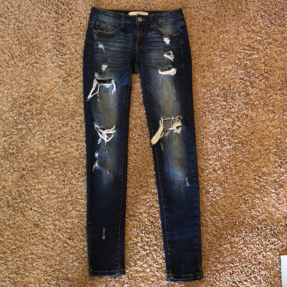 low rise ripped blue jeans
